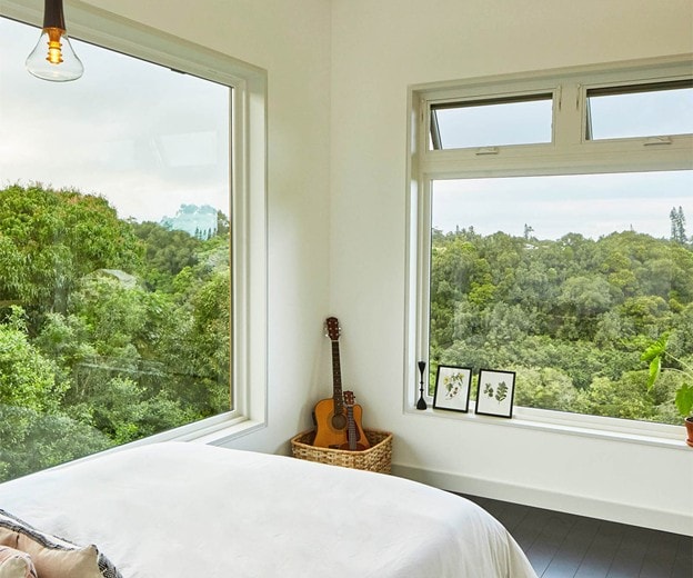Bedroom with garden view windows