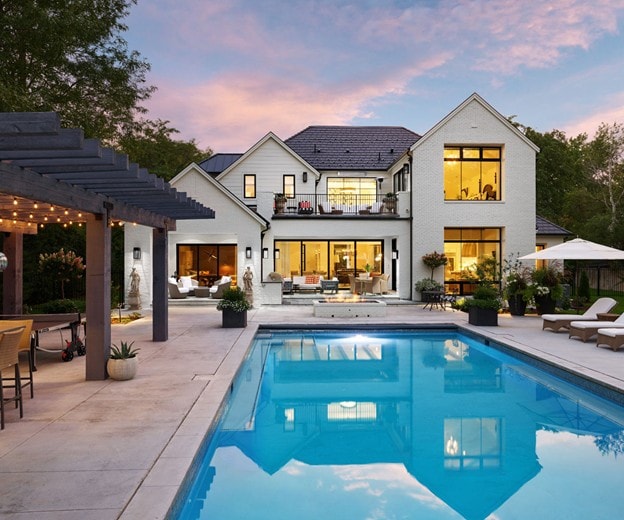 Modern home exterior with pool and Andersen windows