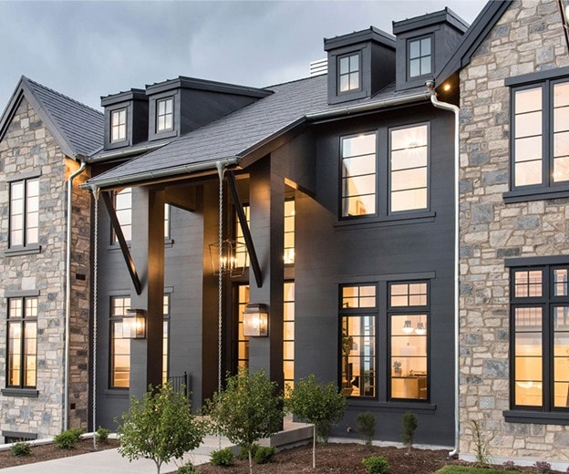Modern stone home exterior with Andersen windows