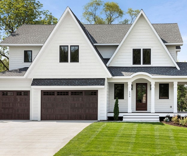White farmhouse exterior with Andersen windows