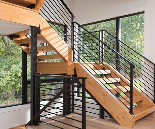 Modern staircase with floor-to-ceiling Andersen windows