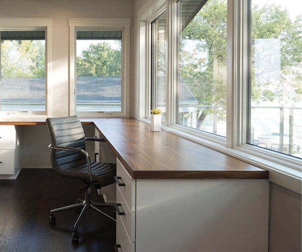 Home office with Andersen windows and waterfront views